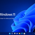 Windows 11 desktop wallpaper with blue abstract background and taskbar interface