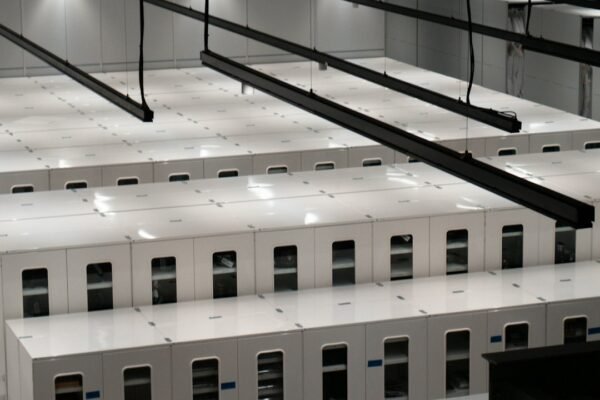 Rows of server cabinets in a modern data center